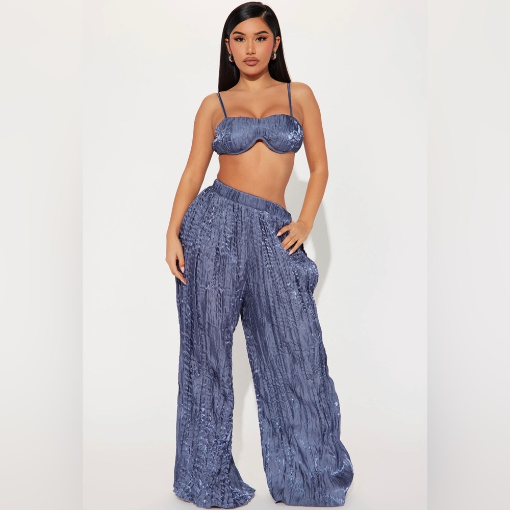 Pleated pant set. NEW. Never been worn. Beautiful two piece